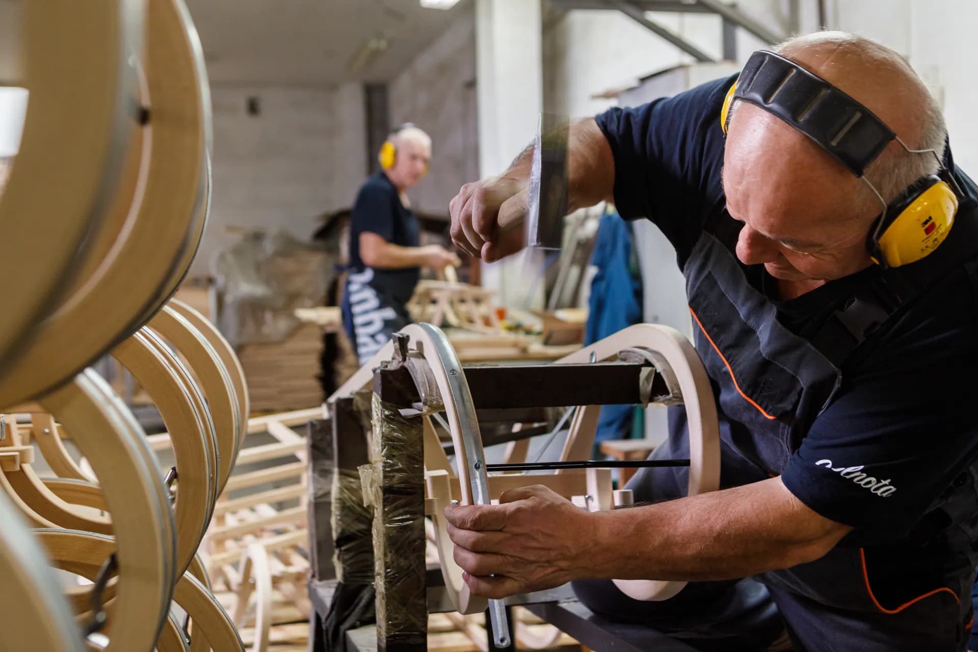 Craftsman repairing wooden furniture in our workshop